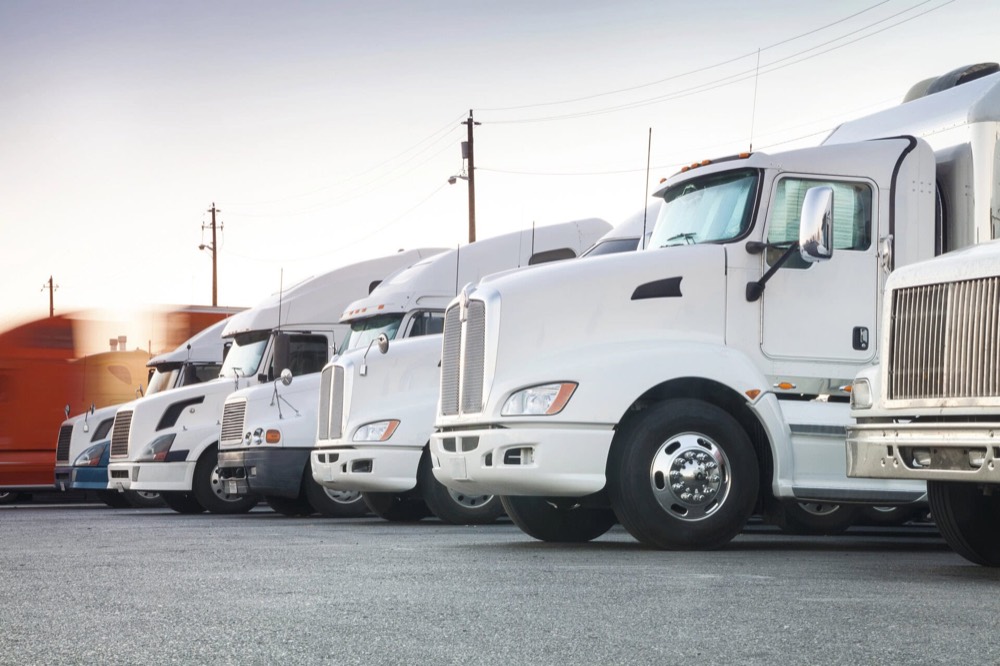Dry van trailers lined up at a distribution warehouse
